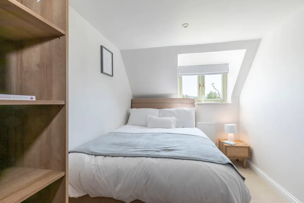Double bed and shared family bathroom for single occupancy